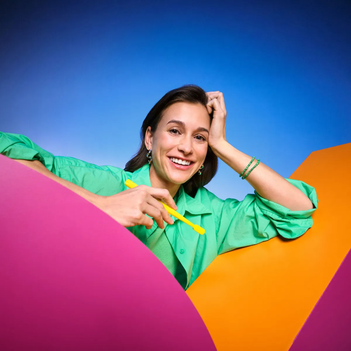 Smiling woman holding toothbrush