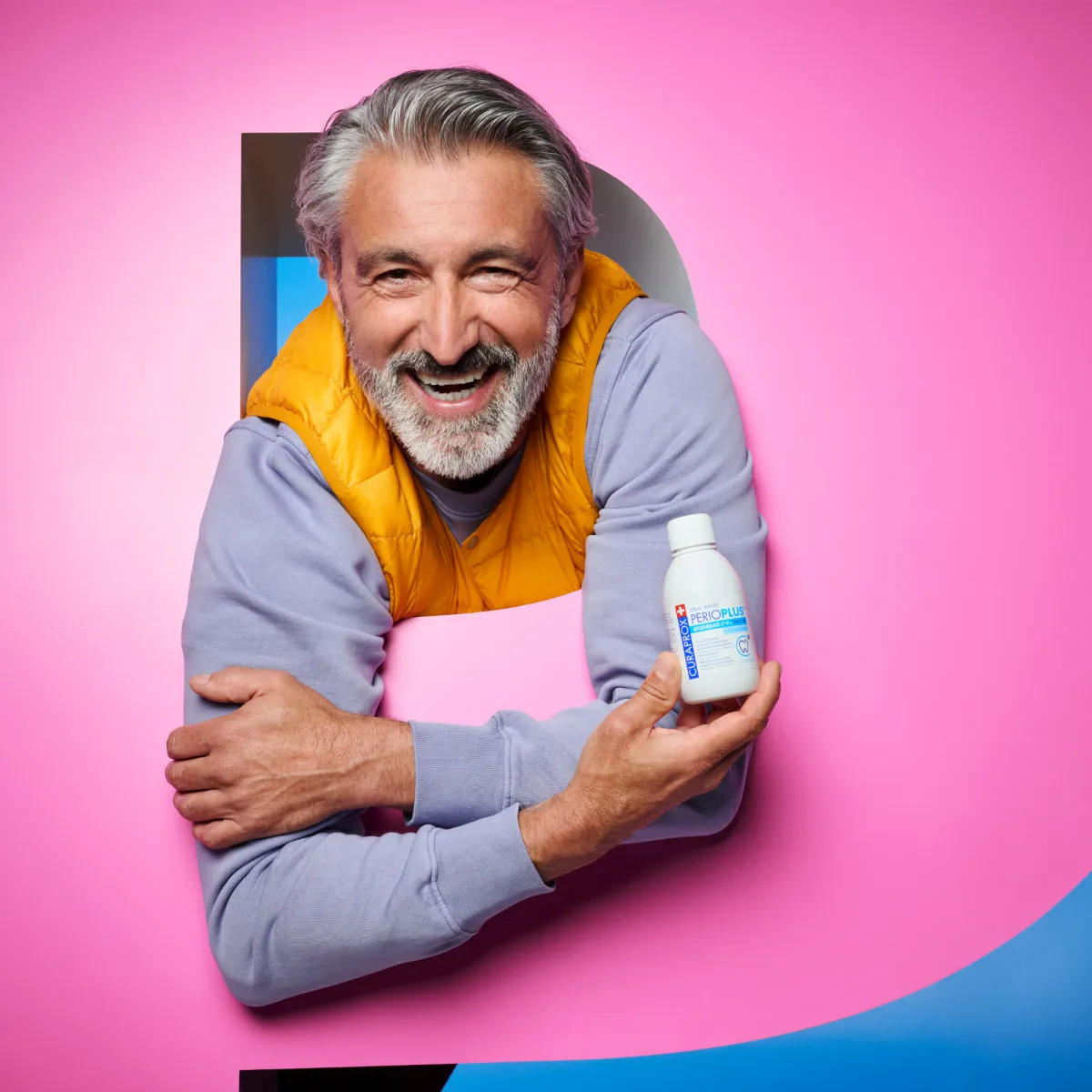 Man holding mouthwash bottle